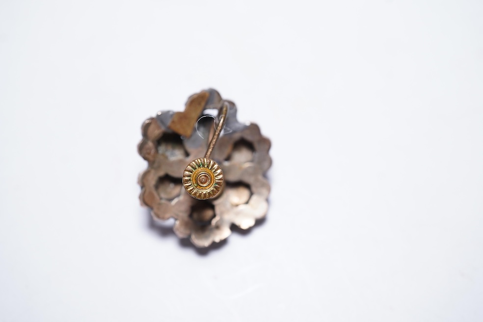 A suite of garnet and paste jewellery, comprising: a brooch, 5cm diameter; a bangle, inner circumference 16cm; two rings, sizes I and M; a pair of earrings, and a single earring, each set with rose-cut garnets; and a pai